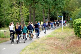 Teenagers cycling safely to school on protected intrastructure