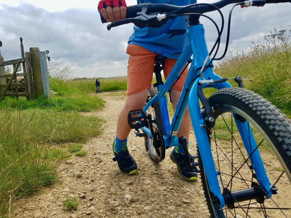 Best kids' bikes: A blue Forme Kinder being tested by our reviewer