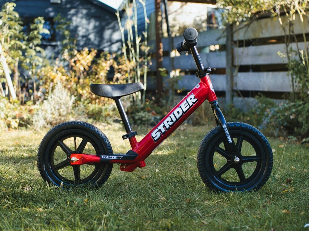 Strider Balance Bike photographed in our reviewers back garden