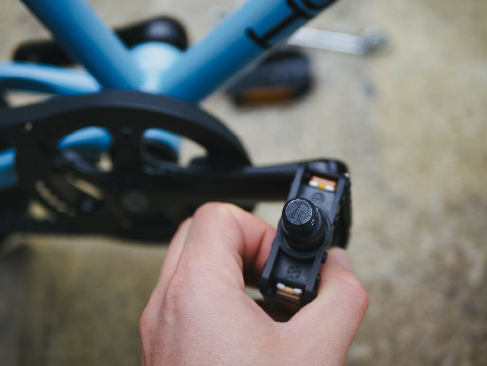 Photo showing putting the pedals back onto a child's bike - the right hand pedal 