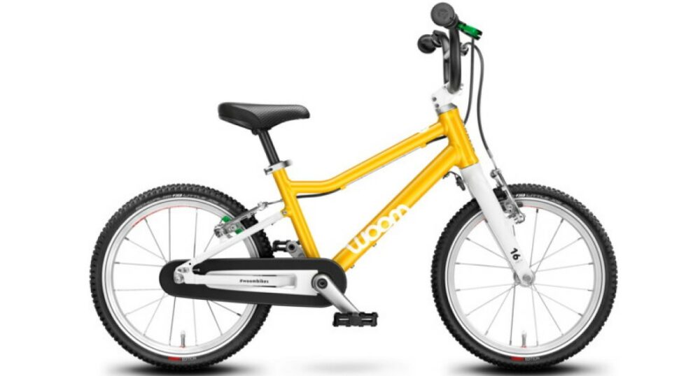 Best kids' bikes: A yellow woom pedal bike on a white background