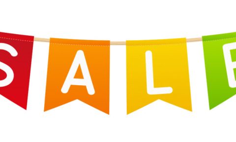 Boxing Day Sales on children's bikes and cycling accessories. Visual Description: Banner with the letters S A L and E on each flag