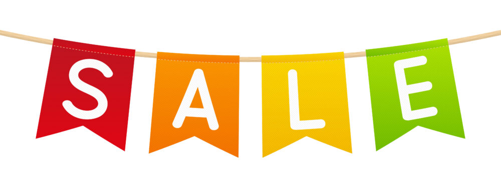 Boxing Day Sales on children's bikes and cycling accessories. Visual Description: Banner with the letters S A L and E on each flag