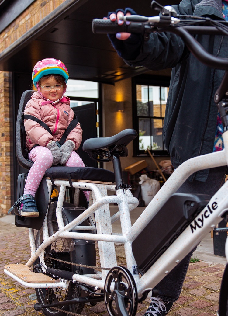 Mycle electric longtail cargo bike with child in bike seat