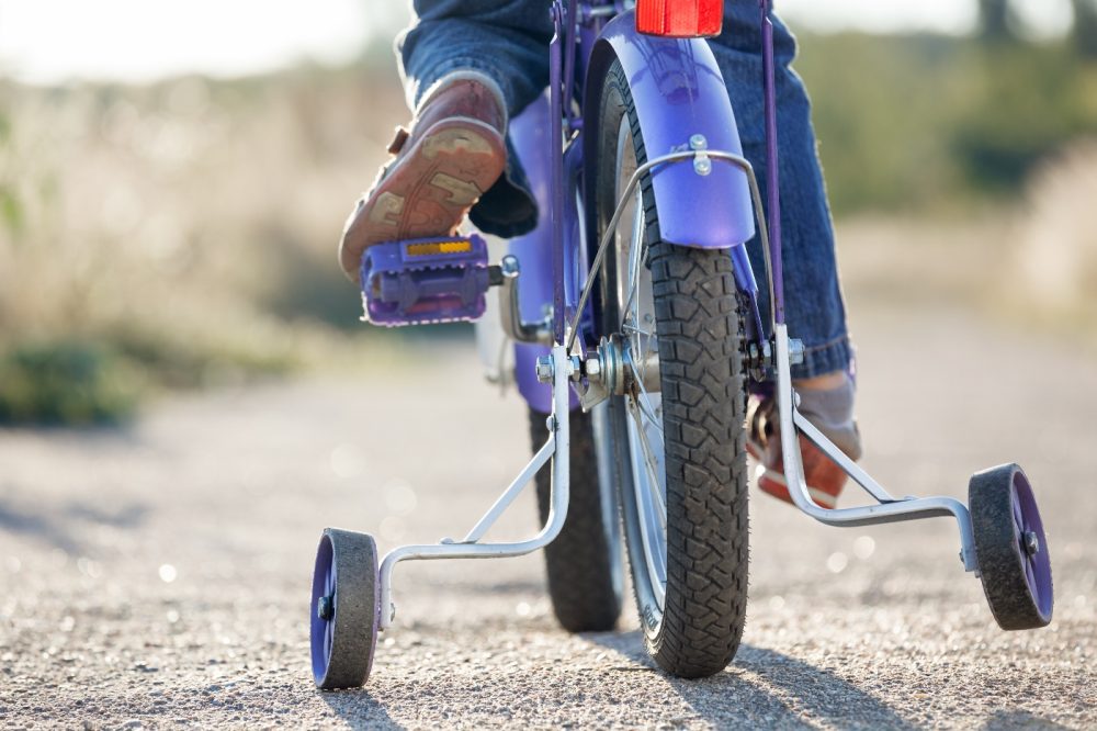 Stabilisers stock photo Teaching your child to ride a bike - stabilisers