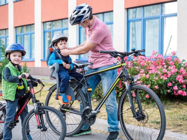 family cycling to school