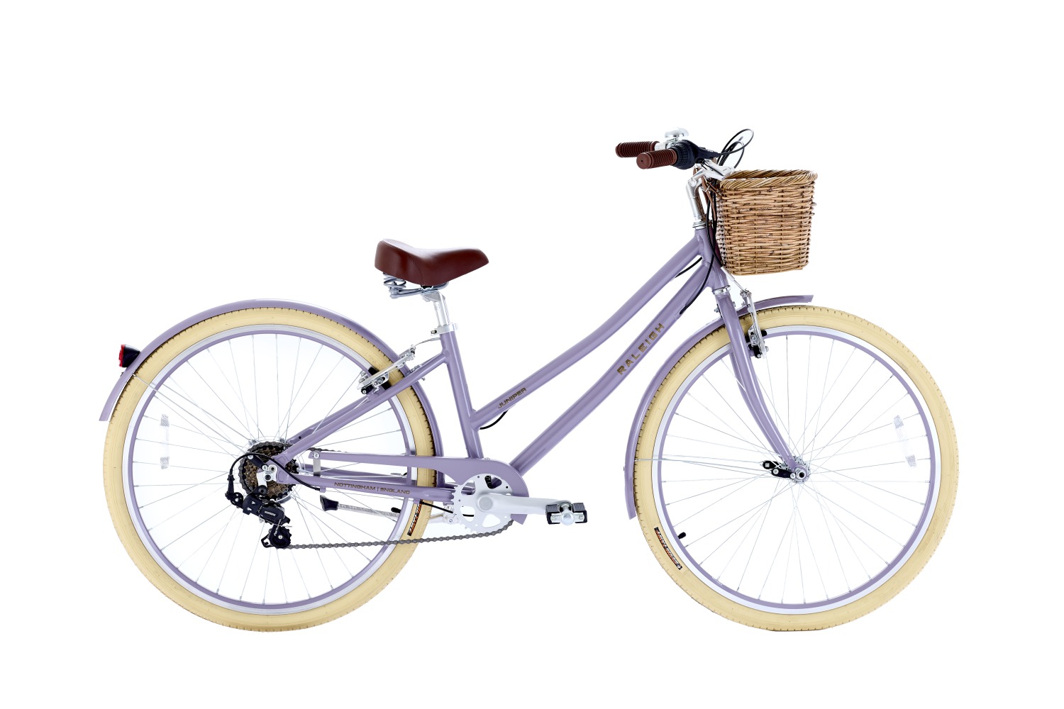The Raleigh Juniper in lilac is a classic style kids bike with a step through frame and basket