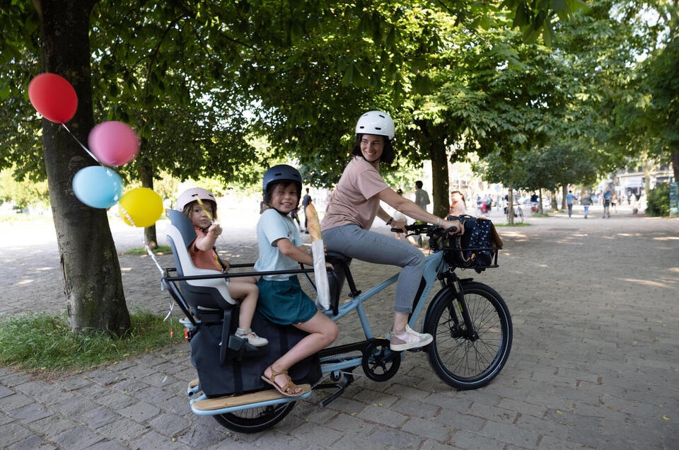Decathlon longtail electric cargo bike with two kids on the back