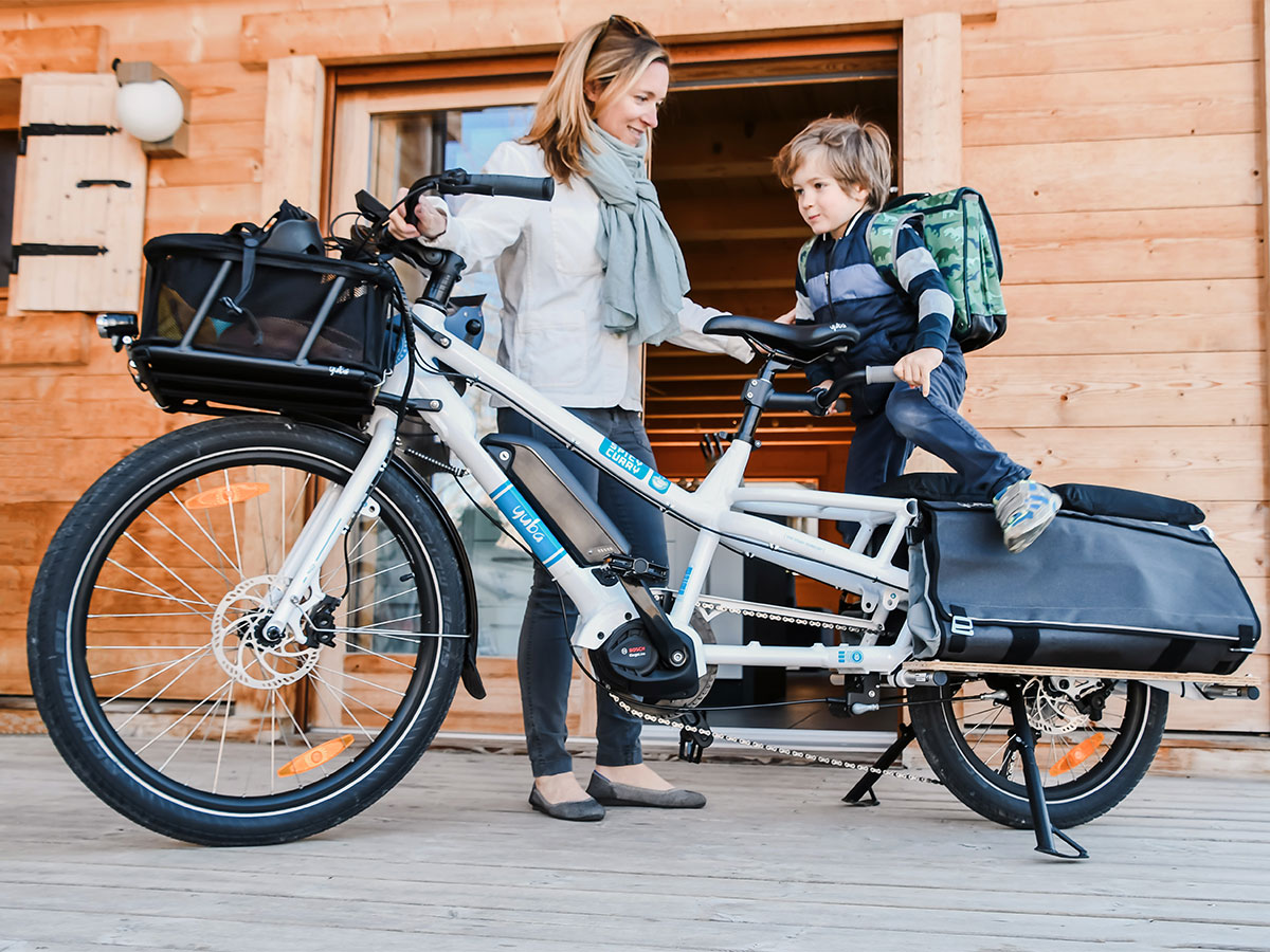 Yuba Spicy Curry electric longtail bike with kids getting on