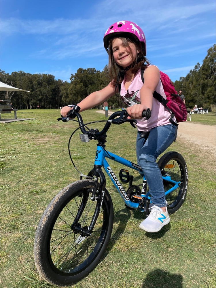 How to choose the right size kids' bike: 6 year old girl on a Kidvelo Rookie 18 Pedal Bike