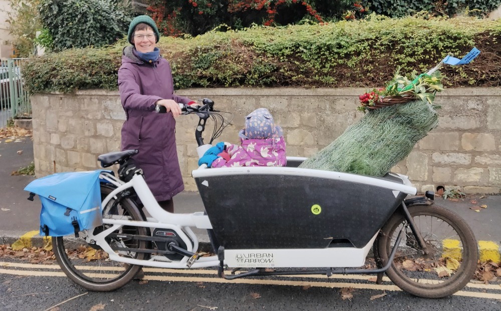 Mycle cargo bike christmas tree and toddler