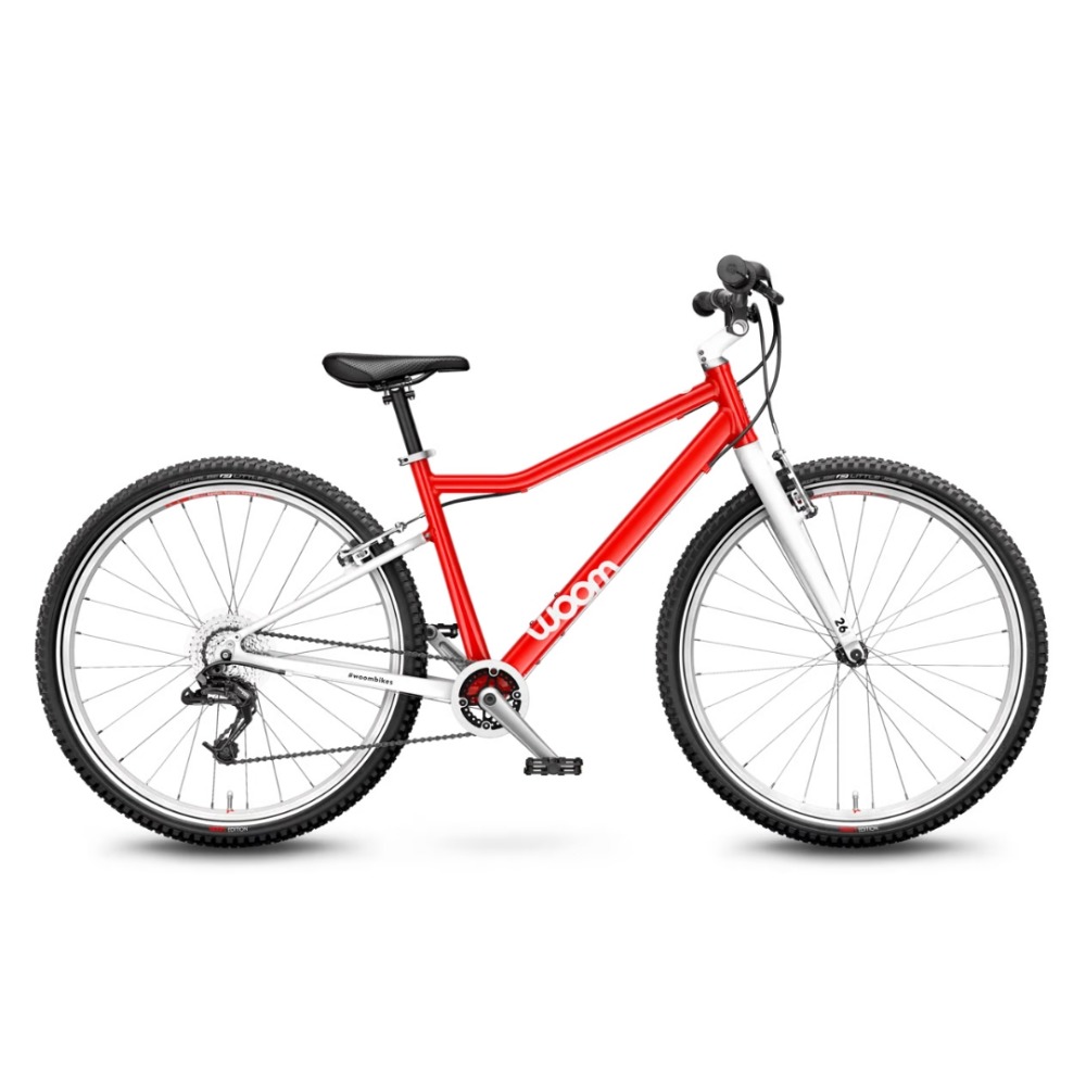Best 26" kids' bikes: A red Woom 6 hybrid bike on a plain background