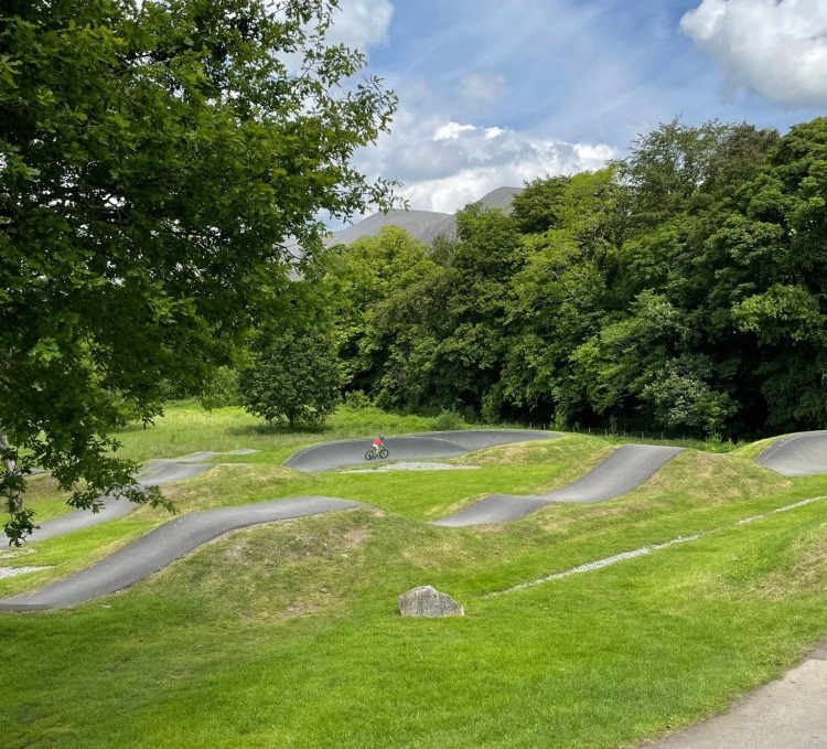 Keswick Pump Track, a good place for kids to ride their bikes whilst on holiday in the Lake District, Cumbria