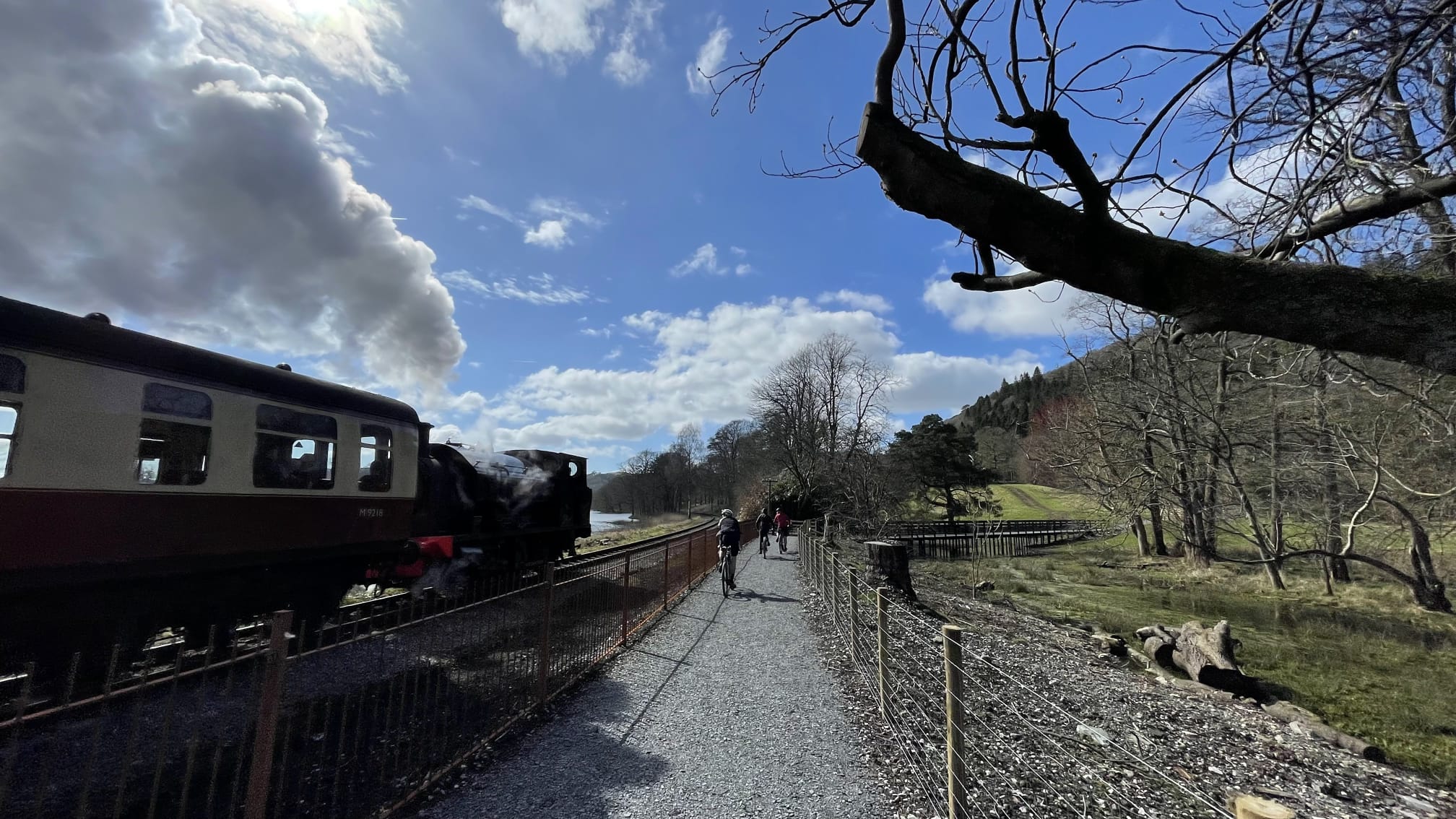 steam train and cyclists along the west windermere way