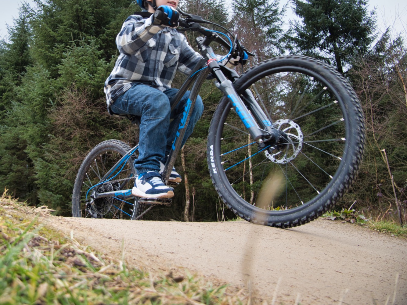 Boy riding the Frog 62 Mountain Bike