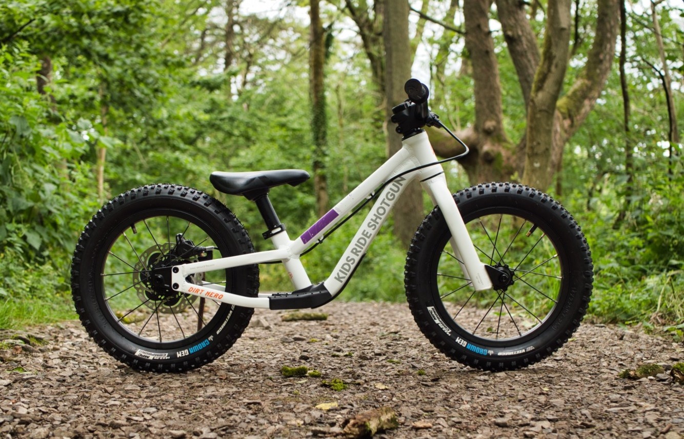 Dirt hero balance bike surrounded by trees