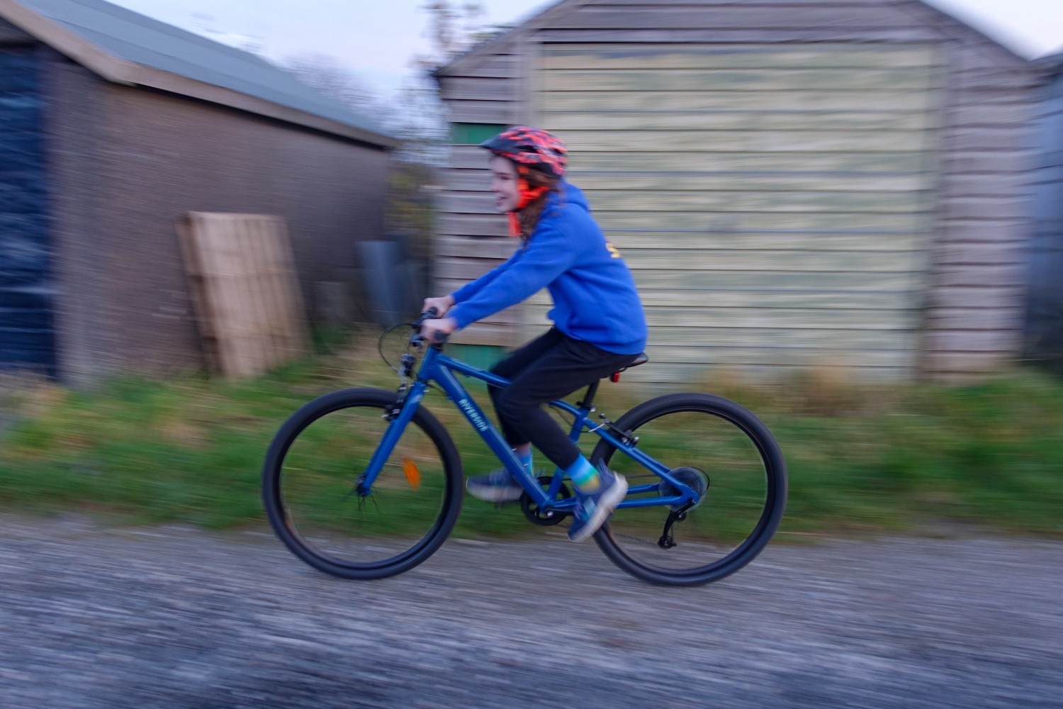 girl in a blue hoodie riding the Blue Riverside 900