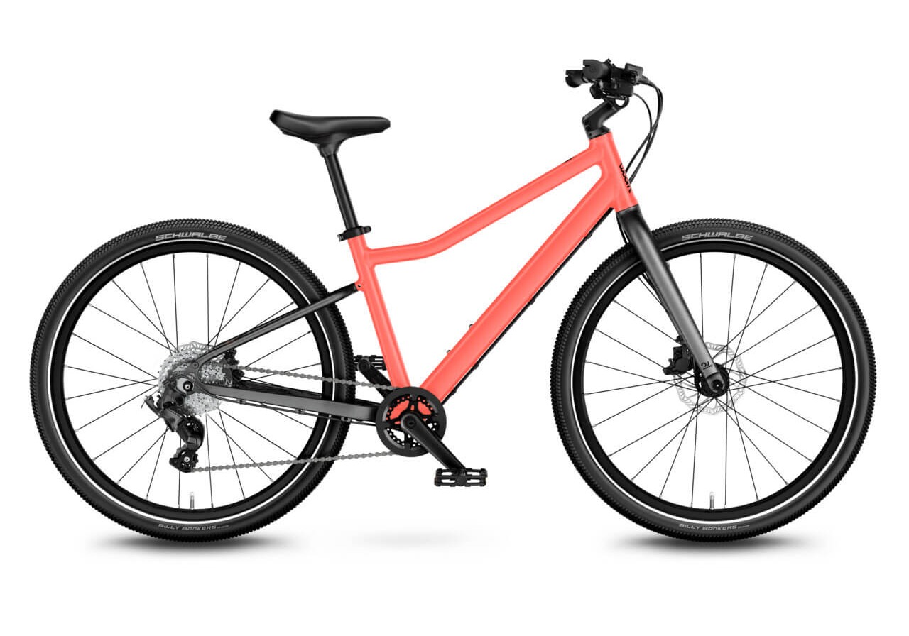 Best 24" kids' bikes: A side view of the woom Explore 5 kids' bike on a blank background