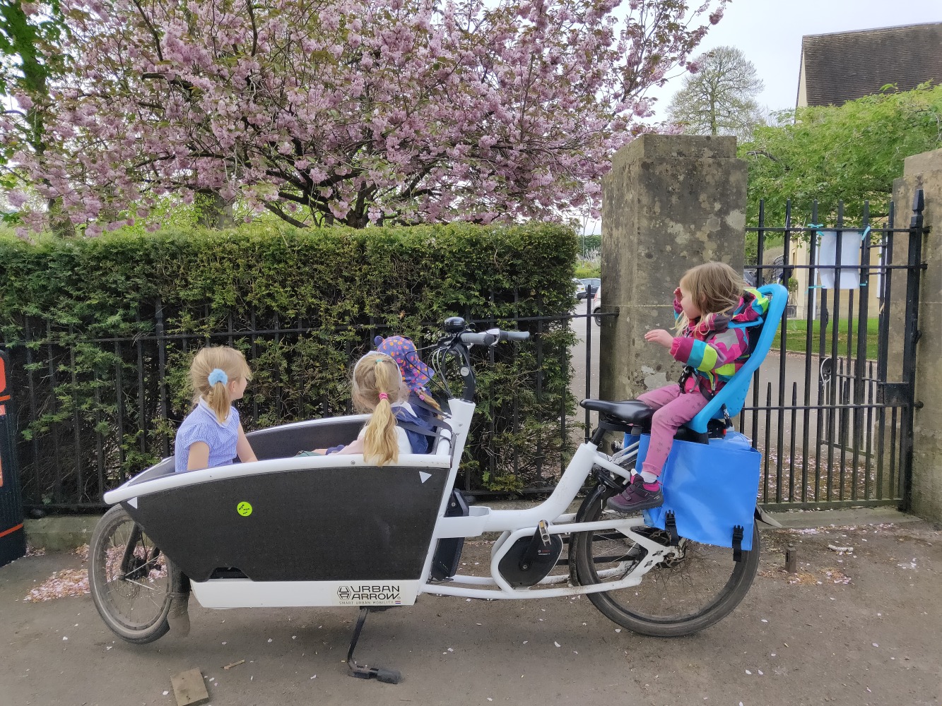 Box bike with four children in it