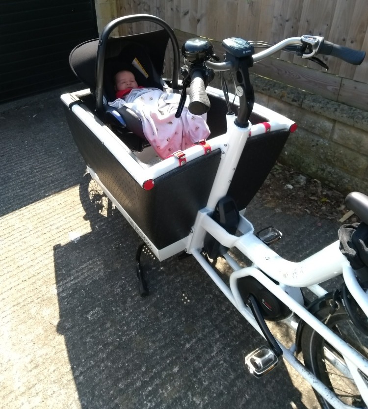 Box bike with car seat carrying baby