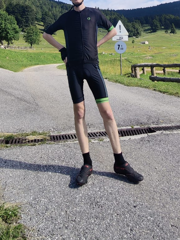 tall and chain black and green jersey and bib shorts