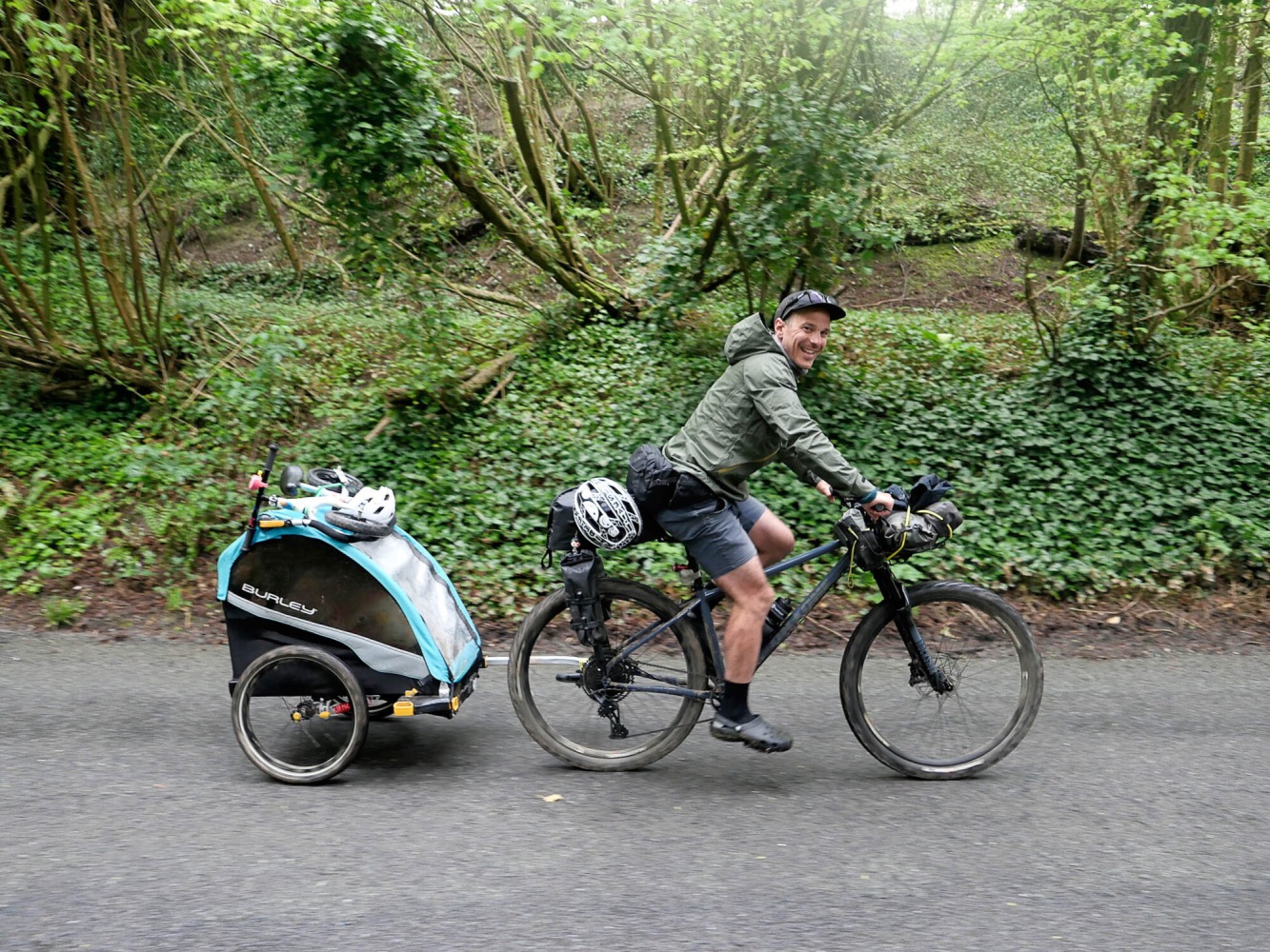 dad bikepacking with a burley trailer