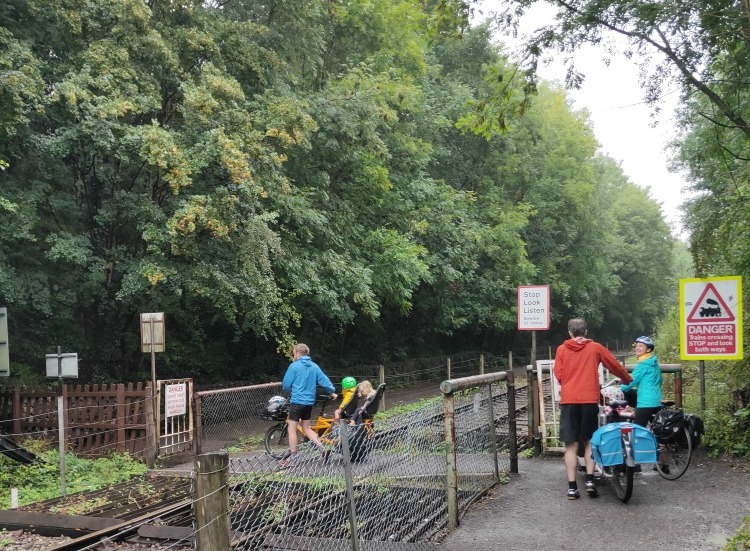 Cargo bikes cross the railway near Bitton on the way from Bath to Bristol