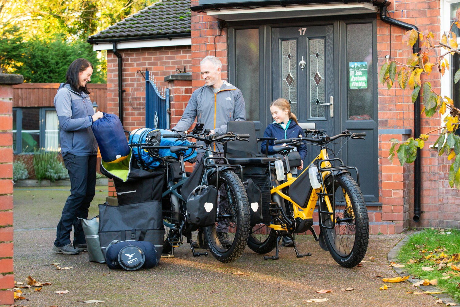 family loading up their two orox cargo bikes