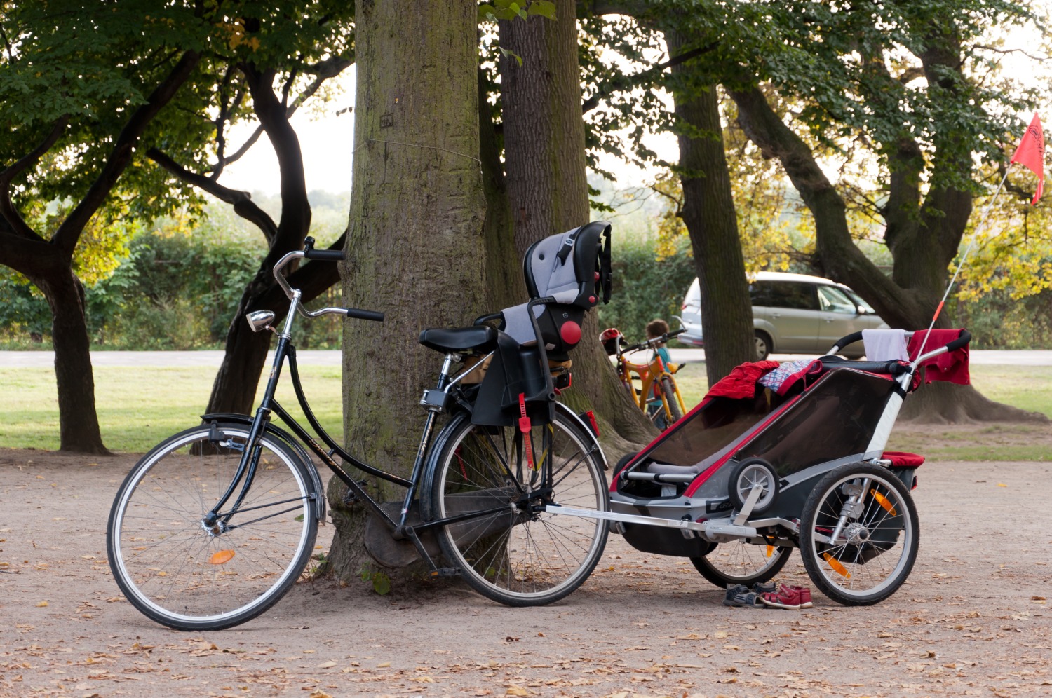 bike with a rear child seat and trailer