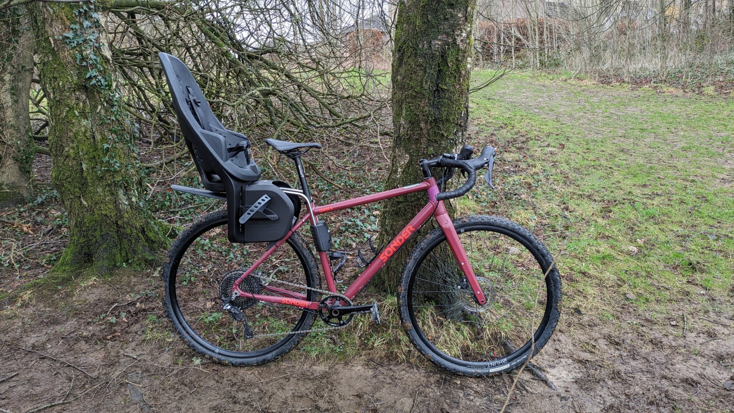 red adults gravel bike with rear child seat