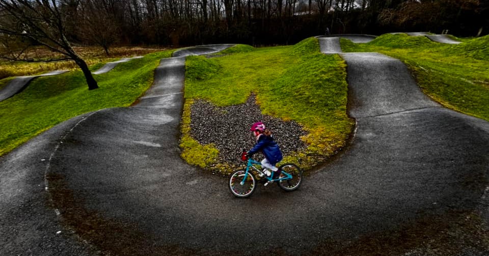 child riding a pump track