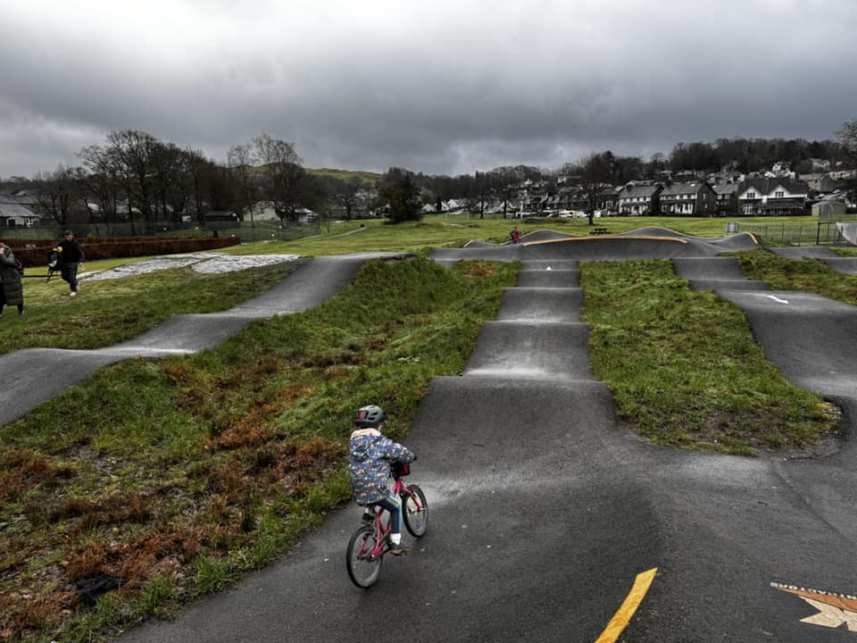 child riding a pump track