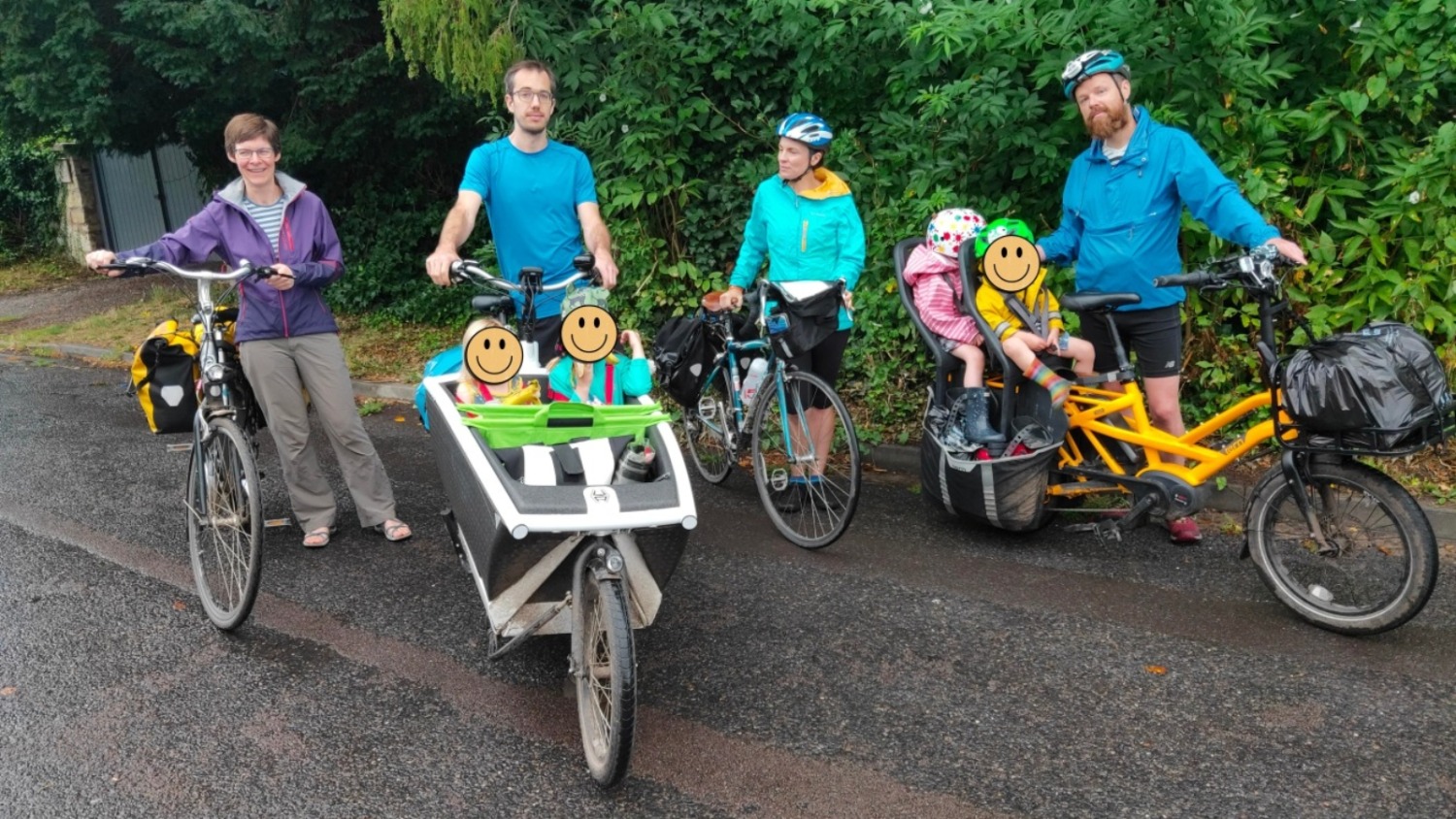 A group of adults with an assortment of cargo bikes and children on board