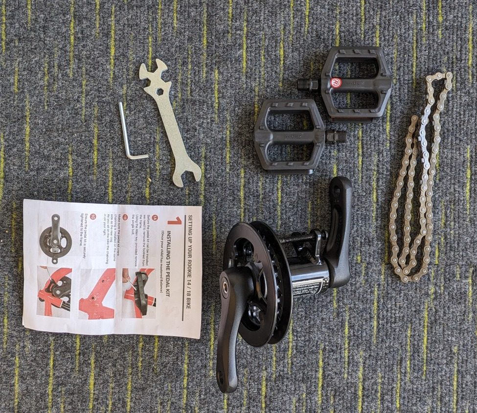 the cranks, chain and tools needed to convert the kidvelo 18 into a pedal bike