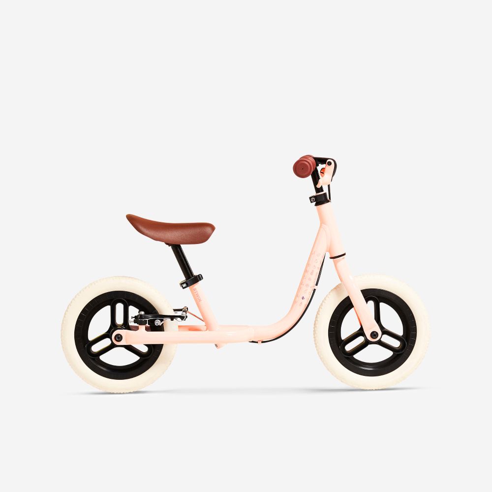 bikes for girls: The btwin runride 500 pink seen from the side on a blank background