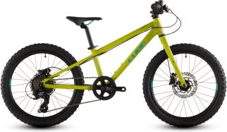 A lime green children's bike on a white background