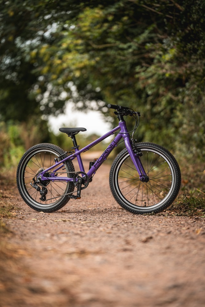 The Hornit HERO 20 standing alone on a gravel path with trees in the background