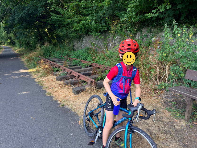 Young boy cycling the Devon coast to coast with his mum