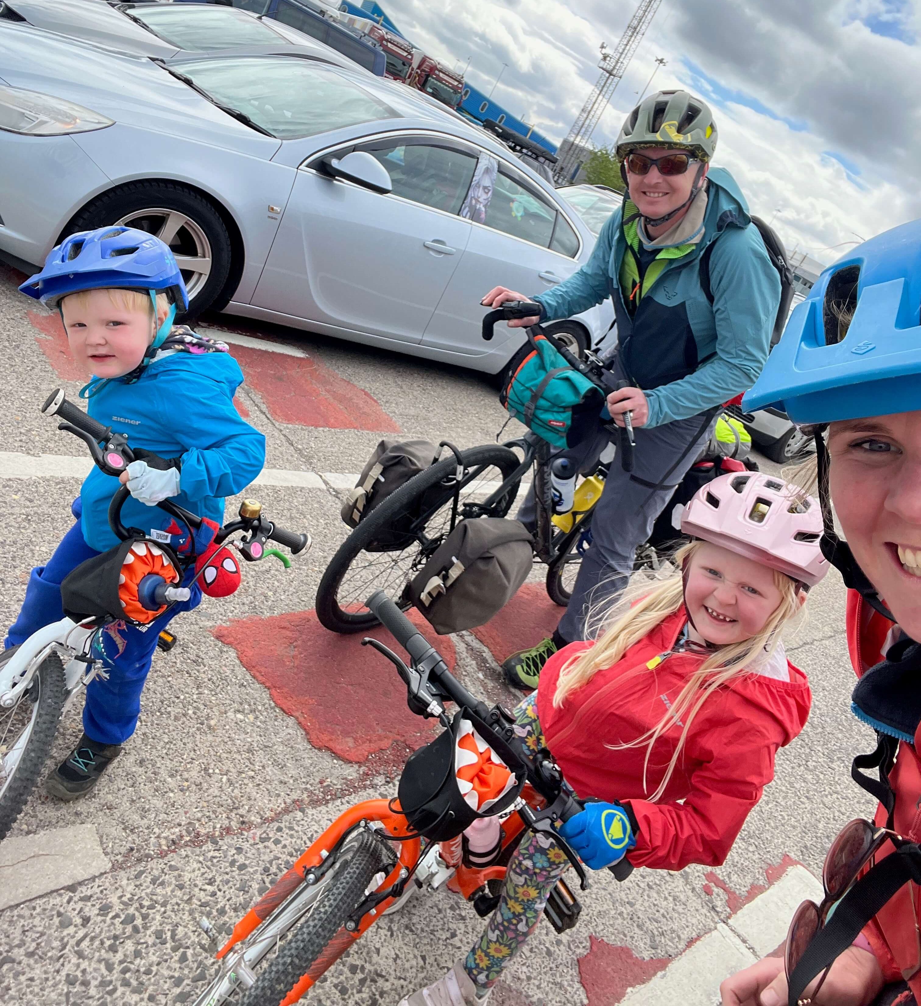 Family on bikes on their cycling holiday in the Netherlands - 2 adults and 2 children